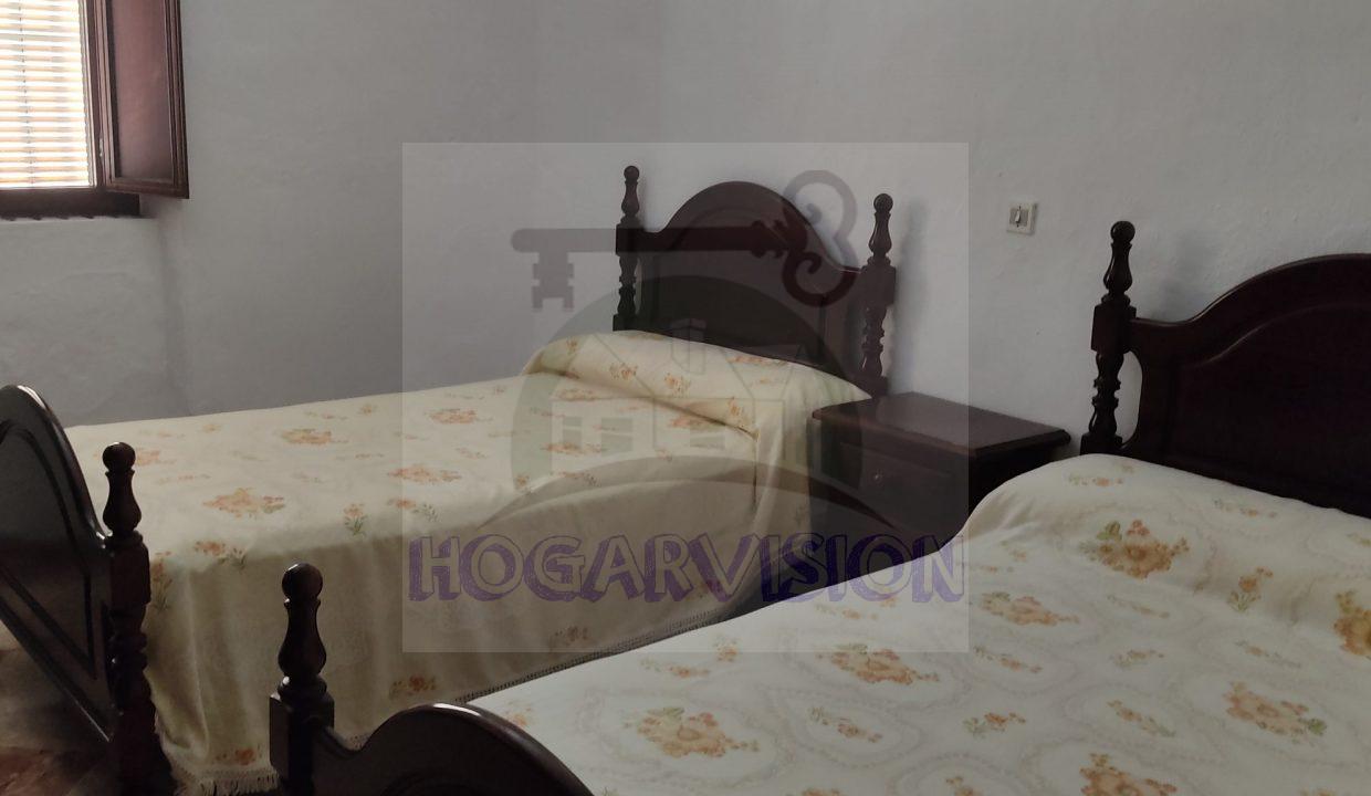 Dormitorio de casa en calle Granada en La Puebla de Cazalla