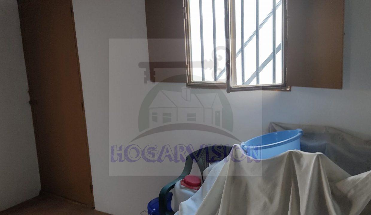 Dormitorio de casa en calle Granada en La Puebla de Cazalla