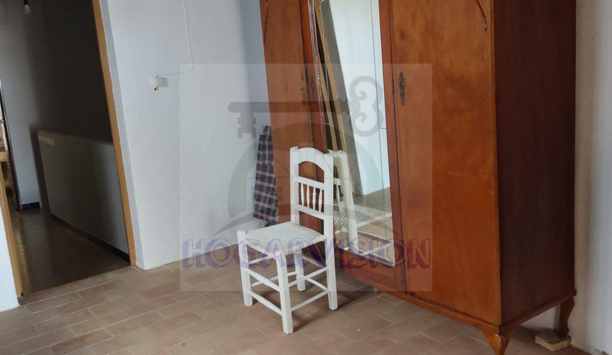 Dormitorio de casa en calle Granada en La Puebla de Cazalla