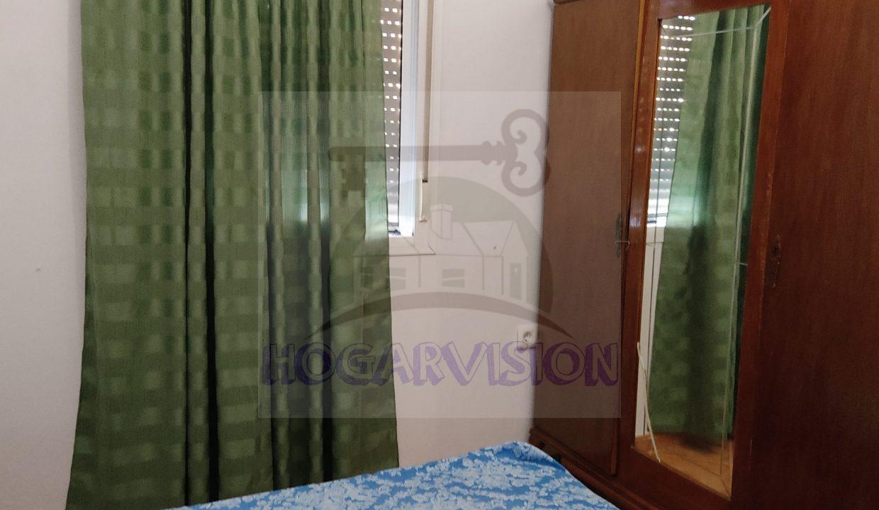 Cortinas en dormitorio matrimonial en chalet en el Manantial