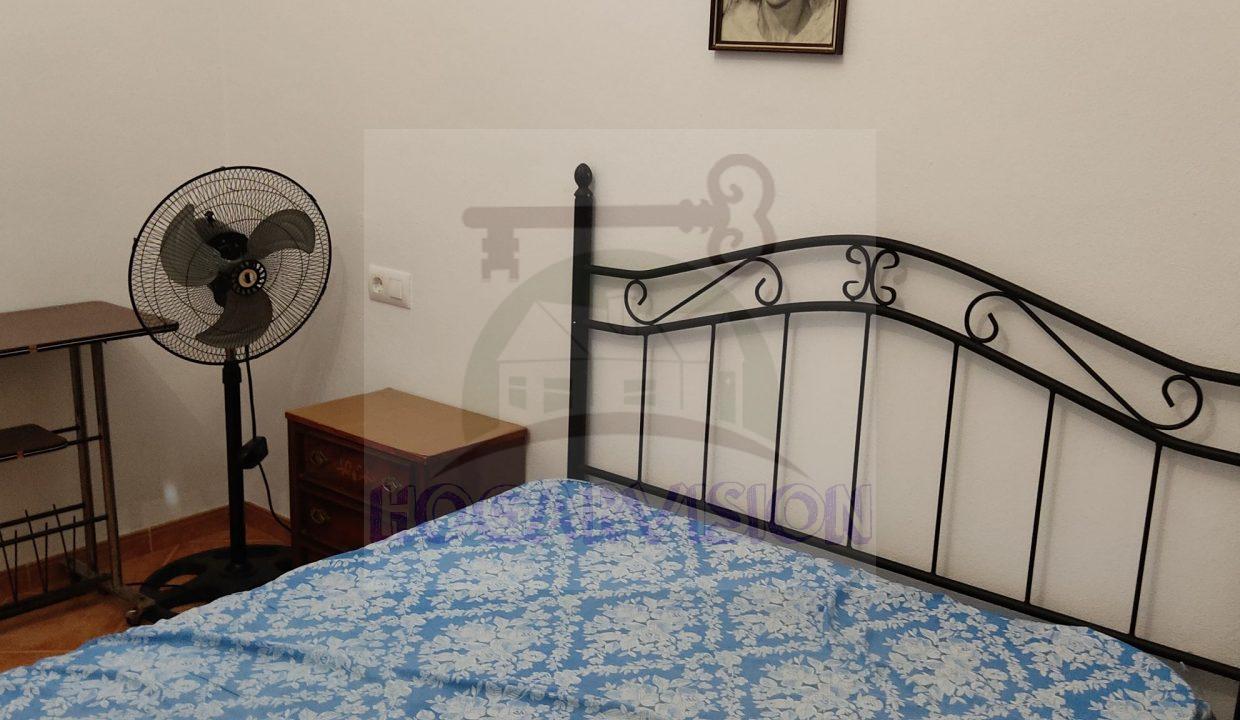 Cortinas en habitación matrimonial en chalet en el Manantial