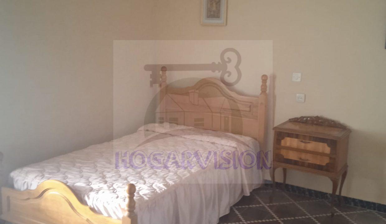 Segundo dormitorio de casa económica en calle Granada en La Puebla de Cazalla